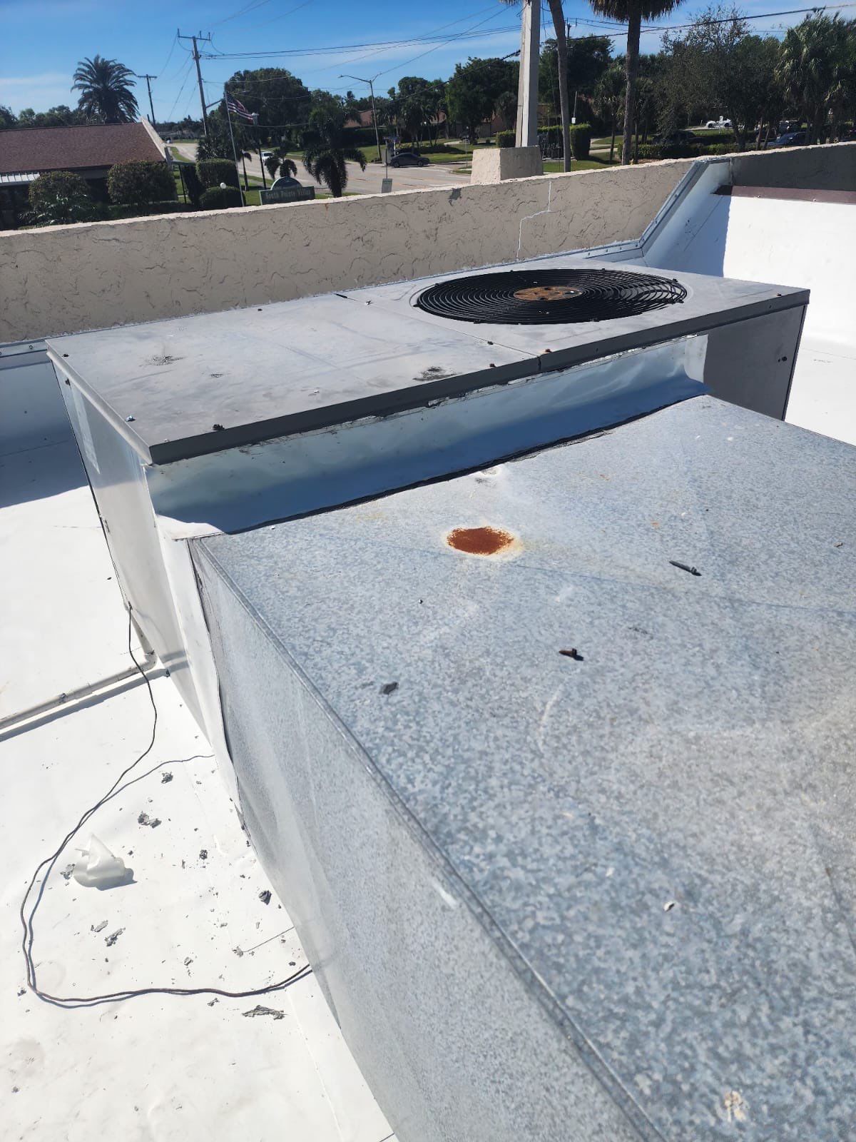 Commercial flat roof aerial view showcasing professional roofing services