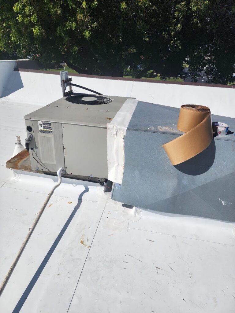 Aerial view of residential neighborhood roofing projects showing community expertise