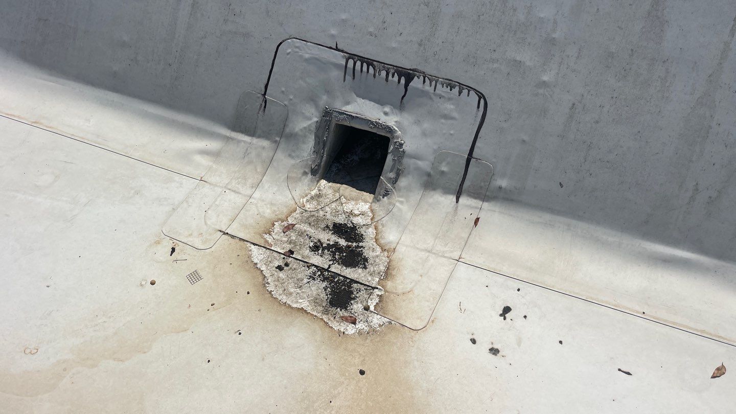 Aerial view of commercial building complex with professional roofing systems