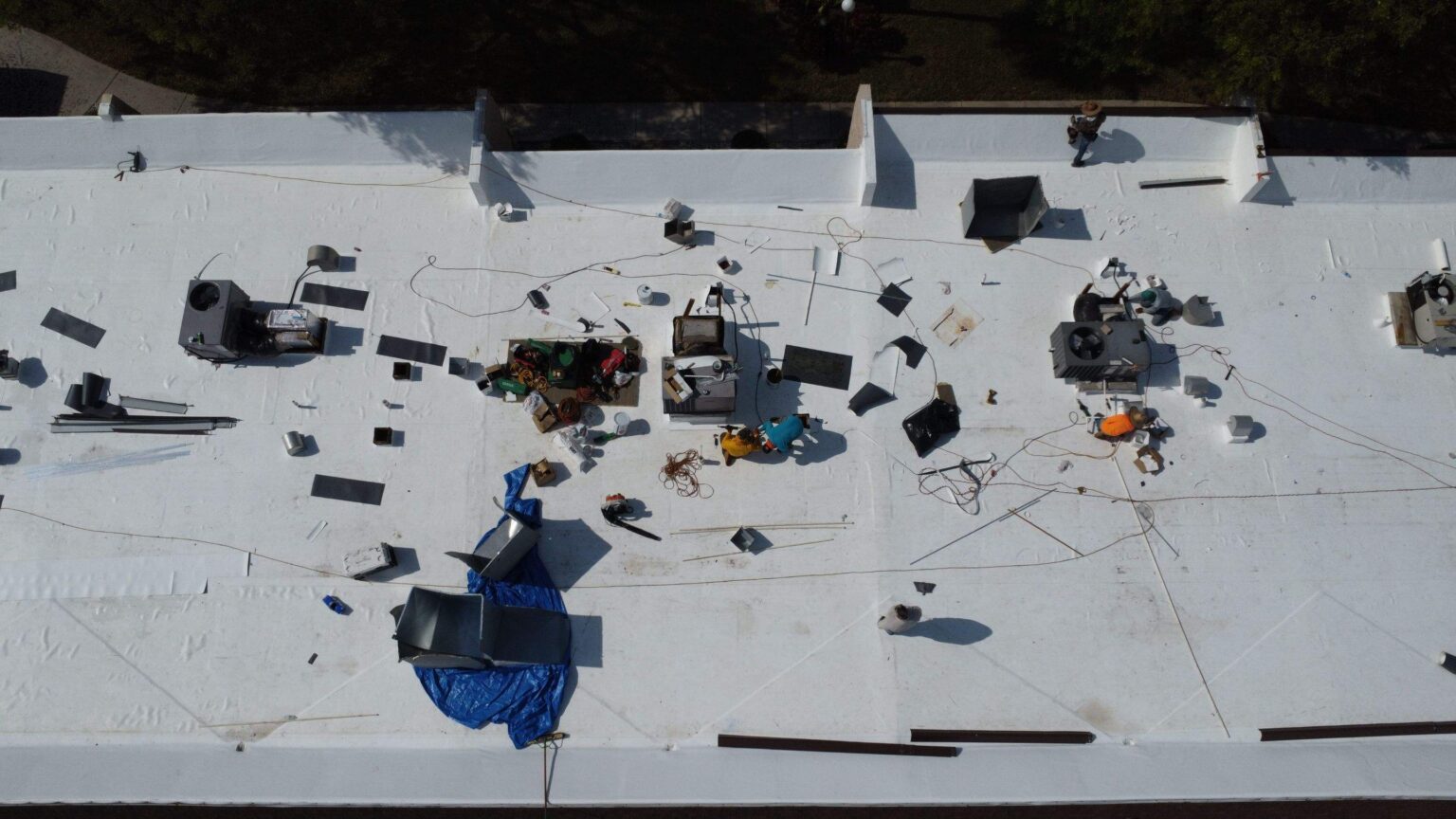 Aerial view of mixed roof types showcasing versatility in roofing materials