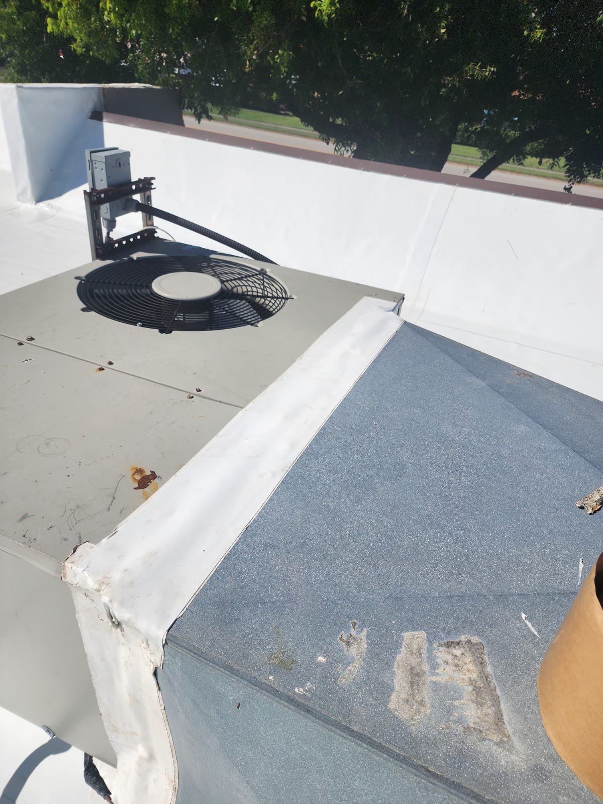 HVAC units maintenance on flat roof showing ongoing service capabilities