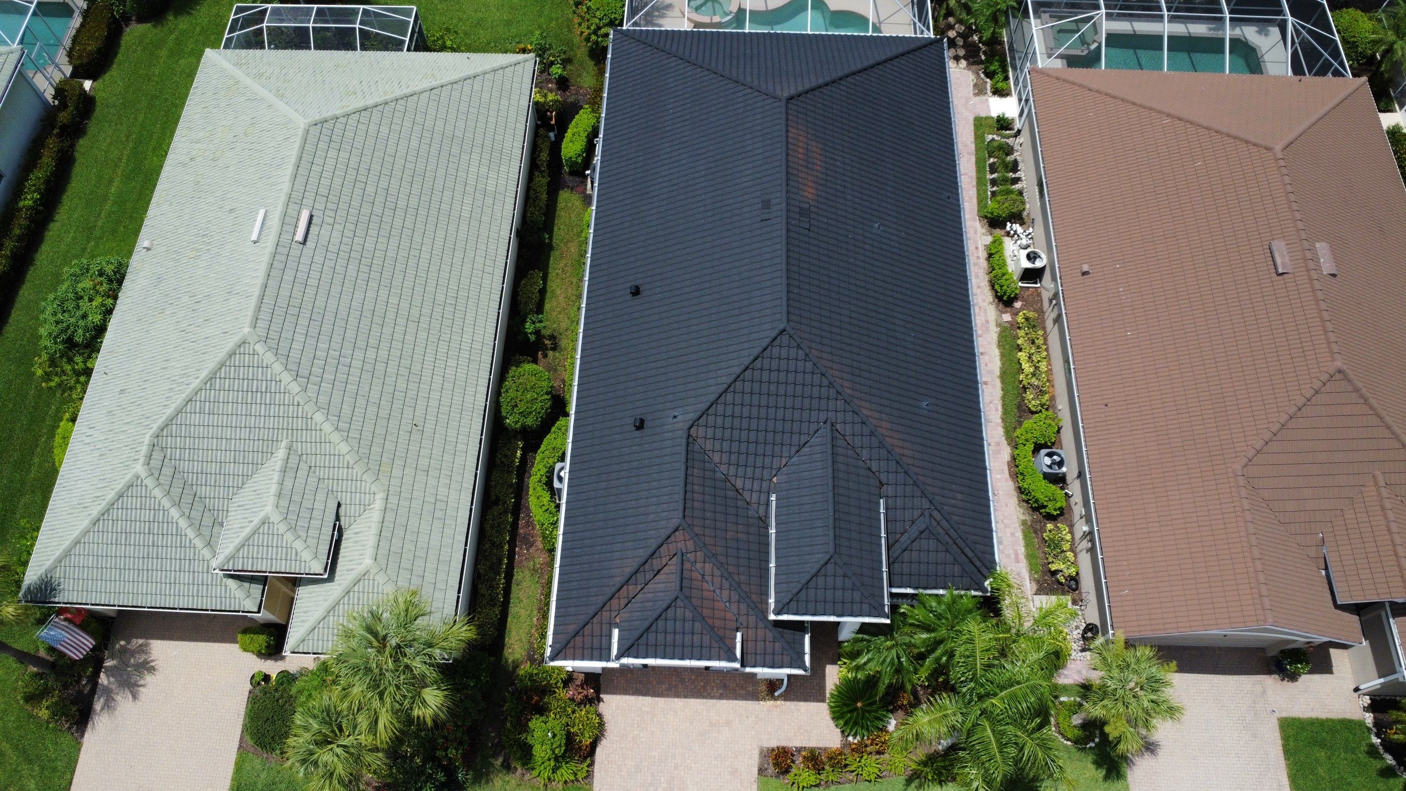 Large residential roofing construction project in progress aerial perspective