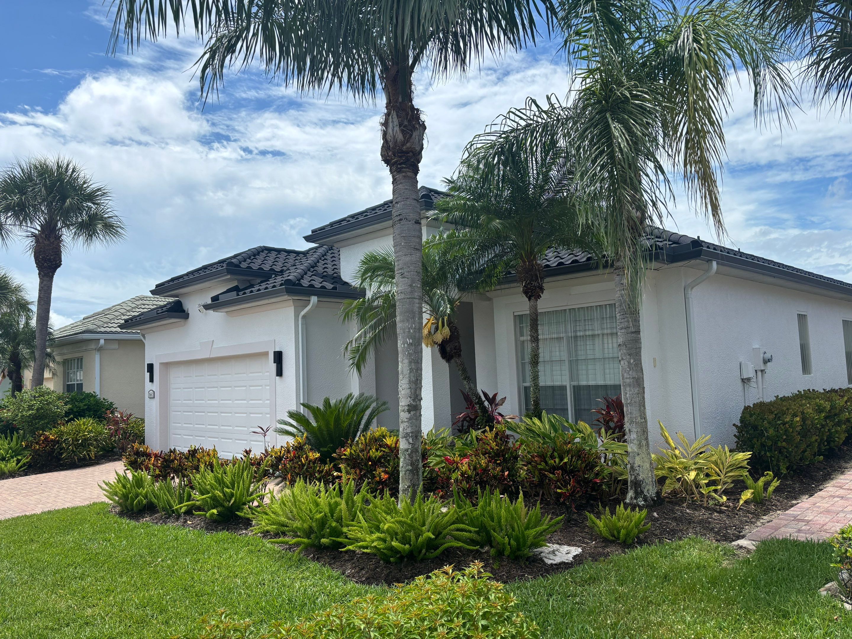 Luxury estate with complex roofing architecture aerial view showing premium quality
