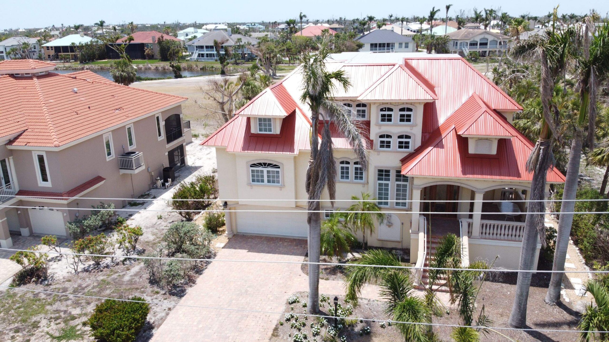 Red metal roofing systems aerial view showing premium metal installation