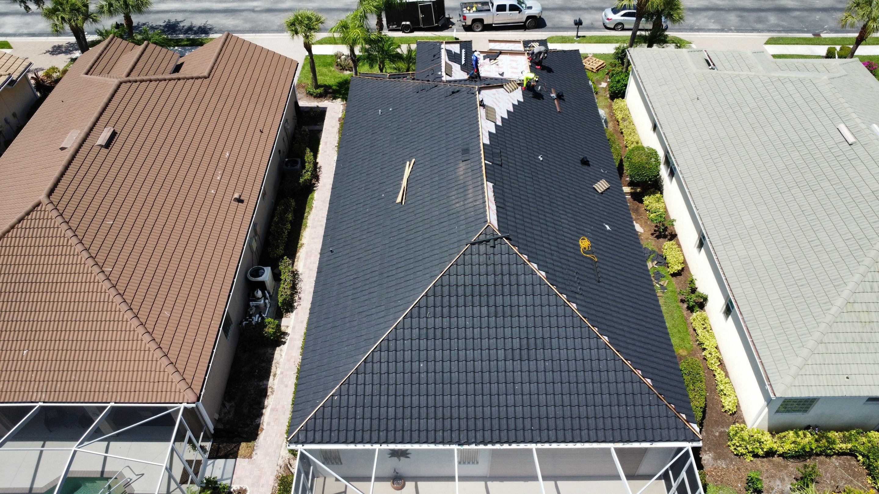 Construction equipment on roofing project aerial view showing professional resources