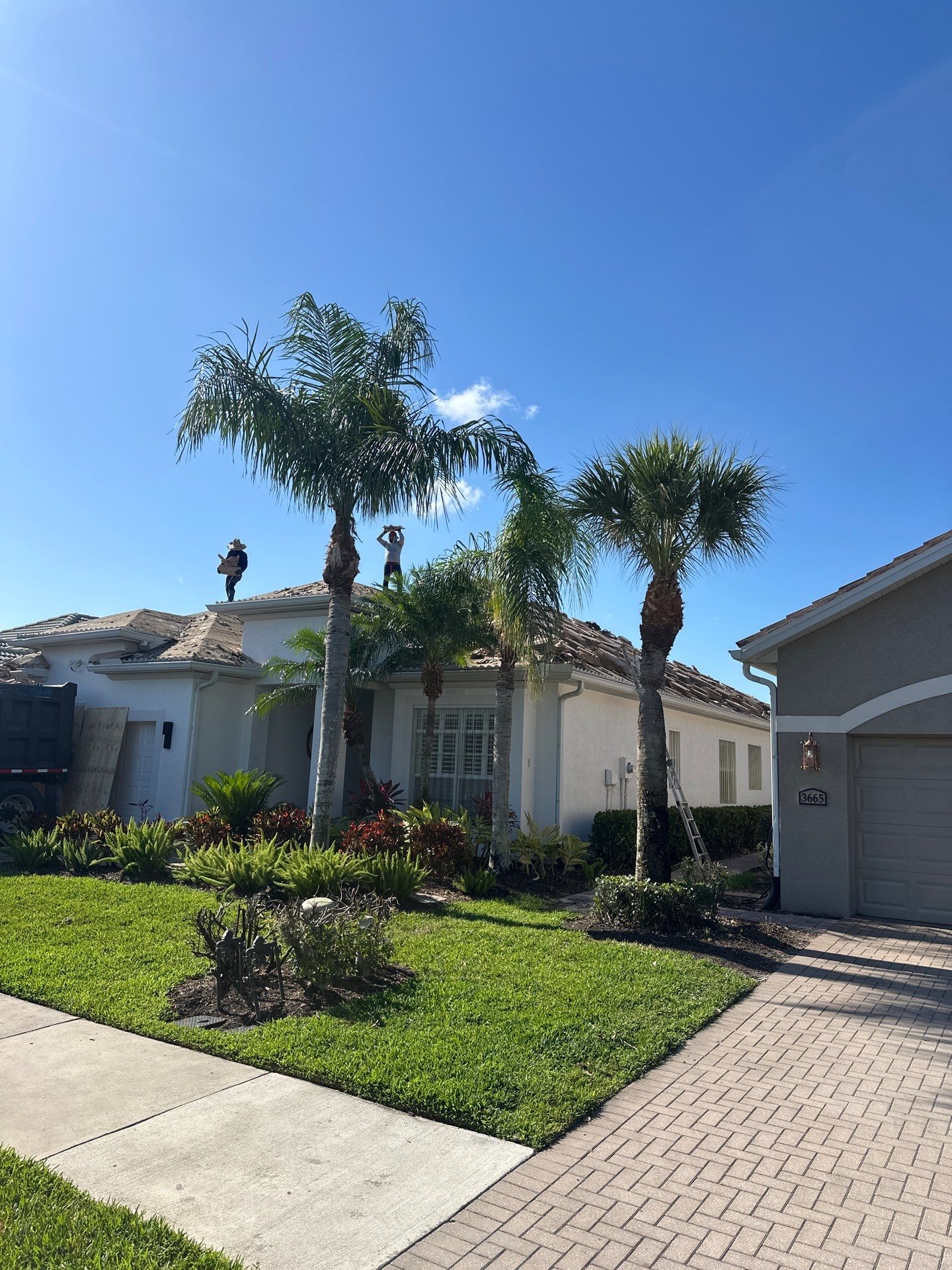 Roof replacement work aerial perspective showing quality replacement process