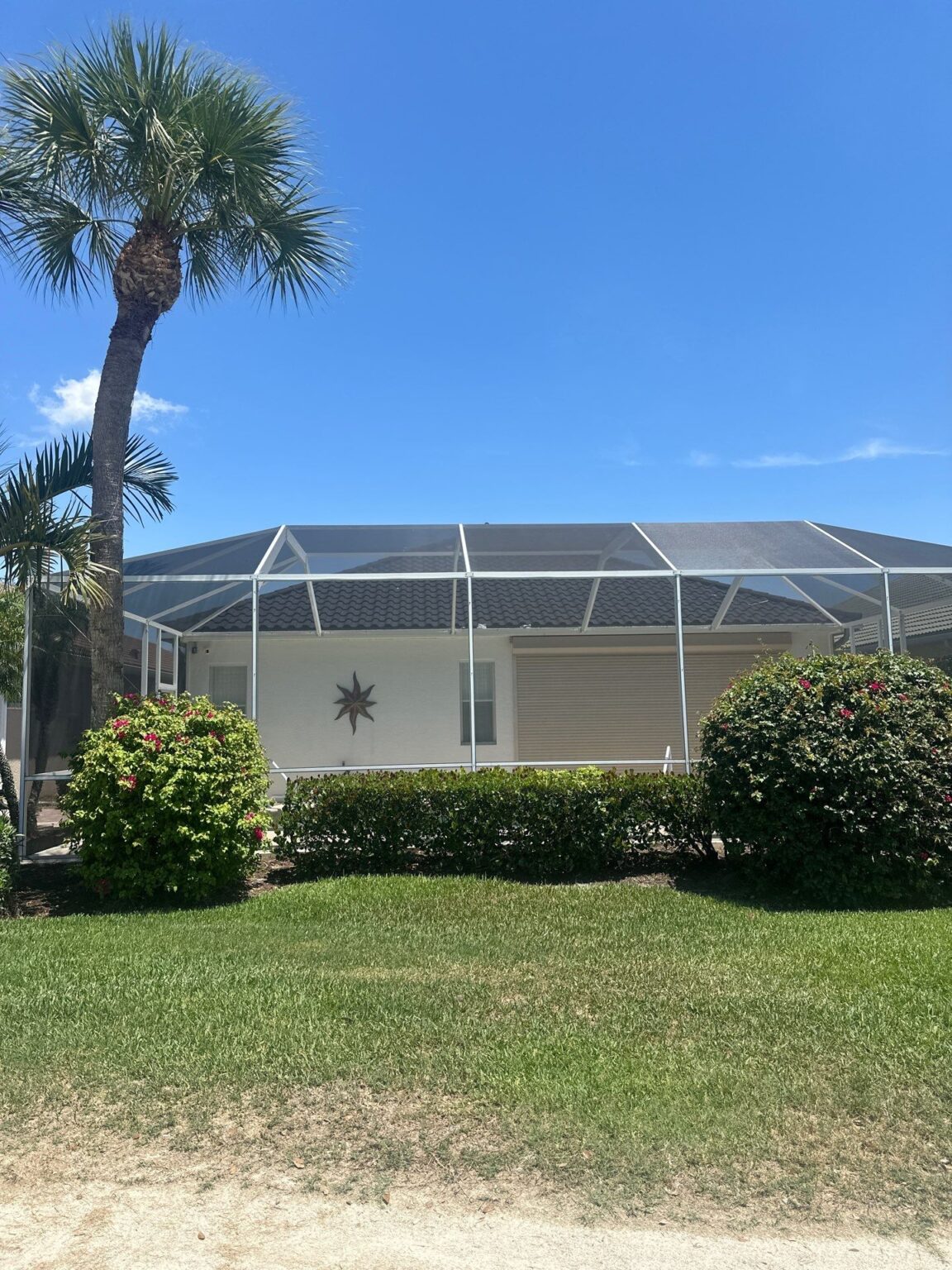 Completed roof with garden landscaping showing integration with landscape