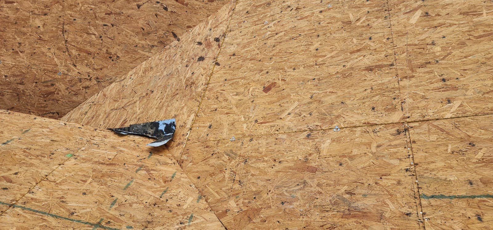 Side view roof completion showing comprehensive roofing coverage