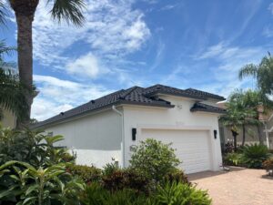 Dark tile roof completion showing premium dark tile installation